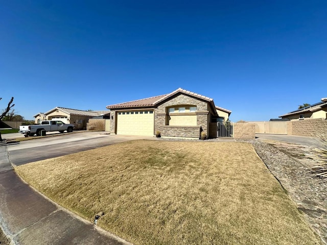 view of front facade with a garage and a front lawn