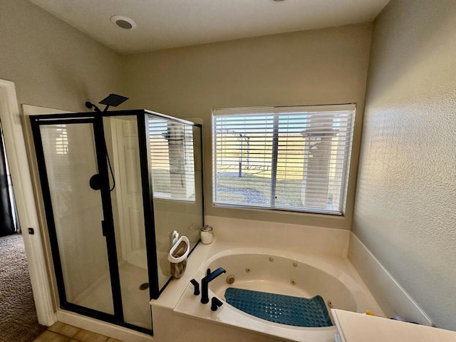 bathroom with independent shower and bath