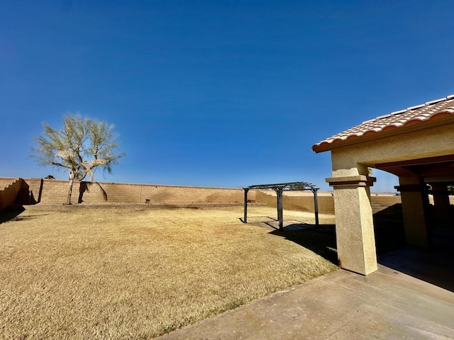 view of yard with a patio and a pergola