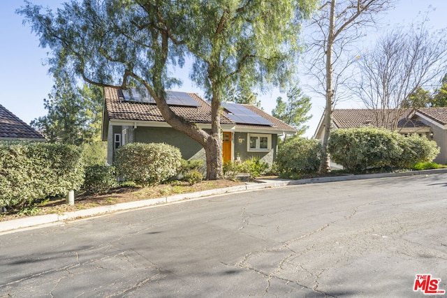 view of front of house with solar panels