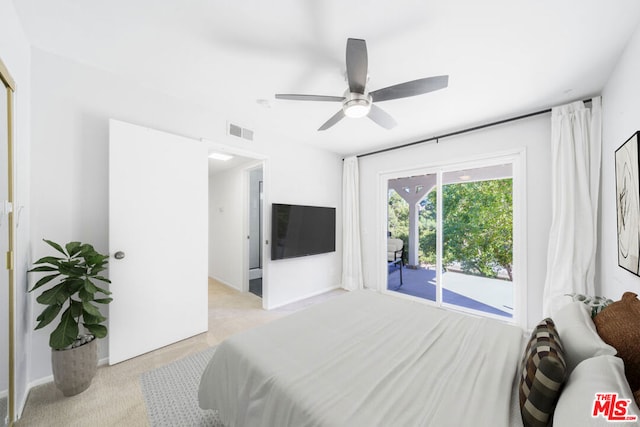 bedroom featuring ceiling fan, access to exterior, and light carpet