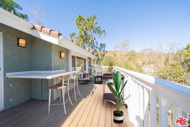 wooden deck with exterior bar