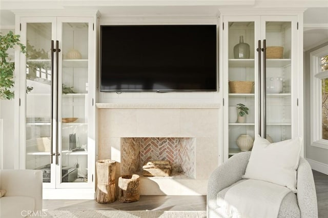 interior space featuring hardwood / wood-style floors and a tile fireplace