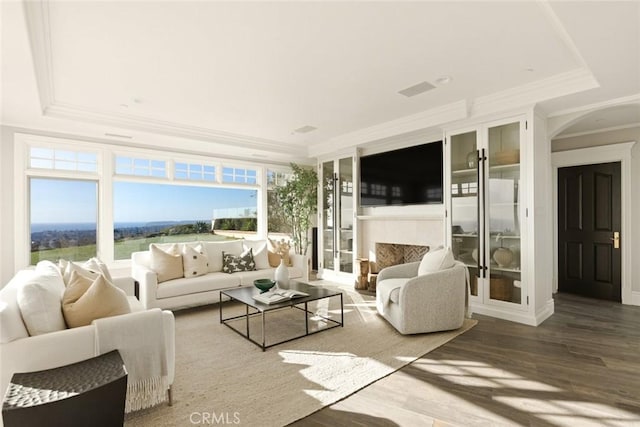 sunroom / solarium featuring a raised ceiling