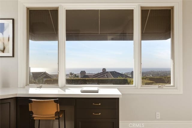 unfurnished office featuring built in desk