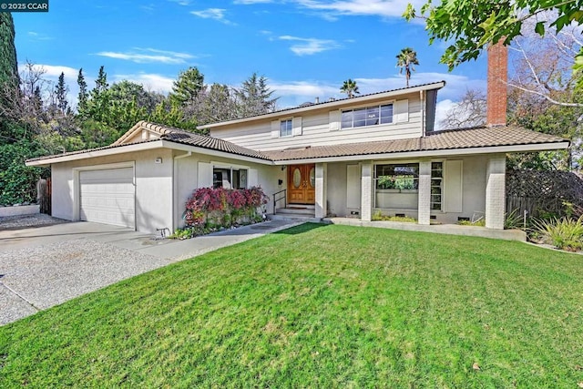 front facade featuring a garage and a front lawn