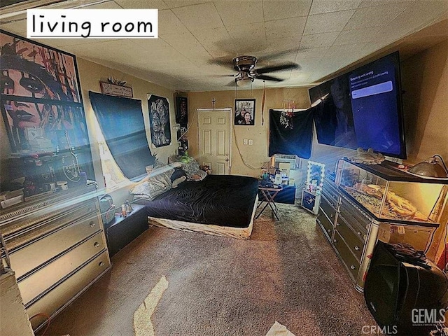 unfurnished bedroom featuring ceiling fan and dark carpet