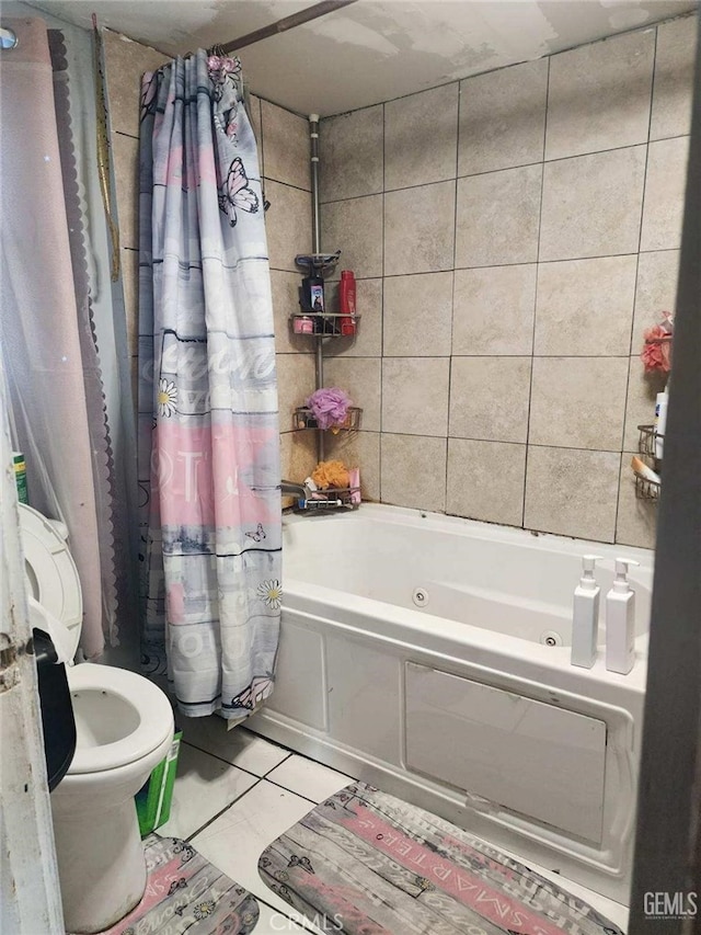 bathroom featuring shower / tub combo, tile patterned flooring, and toilet