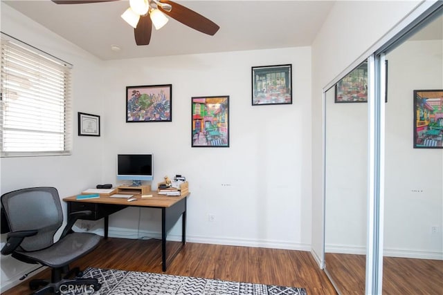 home office with wood-type flooring and ceiling fan