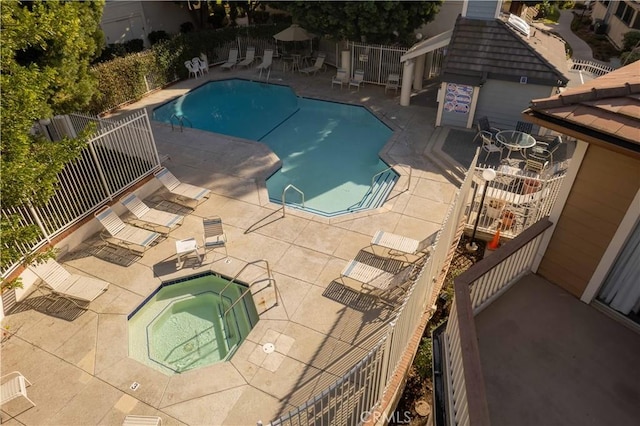 view of pool with a community hot tub