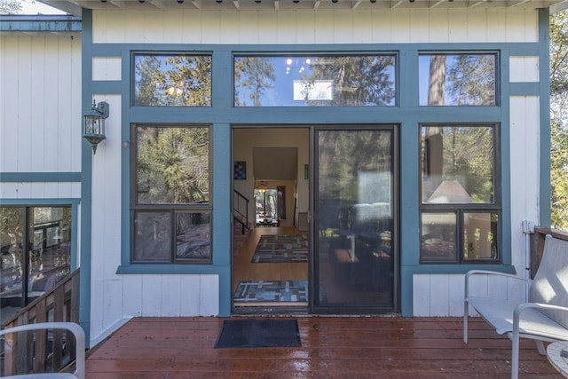 property entrance featuring a wooden deck