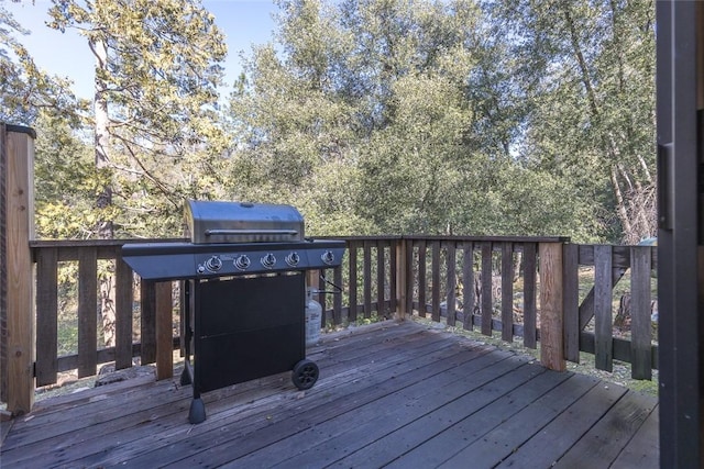 wooden terrace with area for grilling