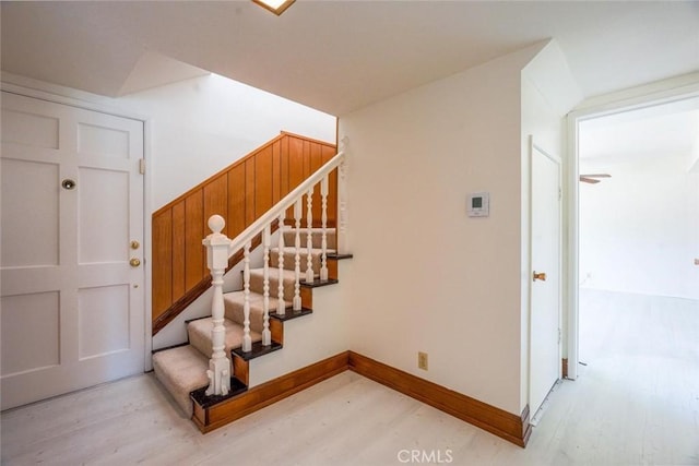 staircase with hardwood / wood-style flooring