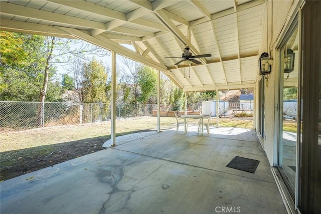 view of patio featuring ceiling fan and a storage unit