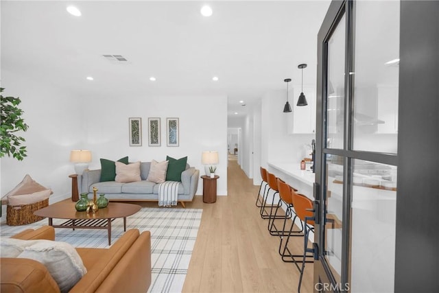 living room featuring light wood-type flooring