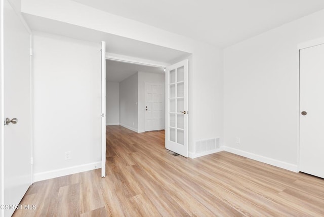 unfurnished room with light hardwood / wood-style flooring