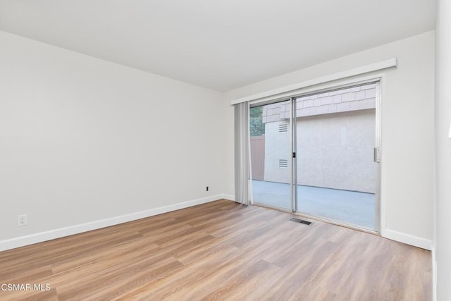 empty room with light wood-type flooring