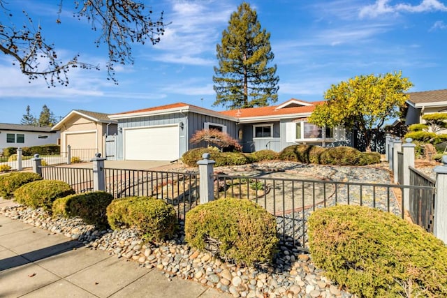 ranch-style house featuring a garage