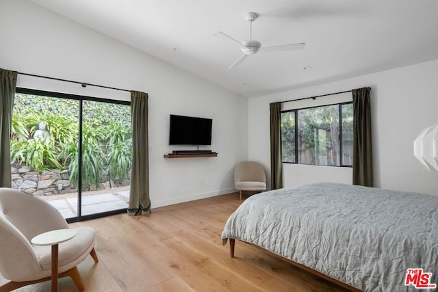 bedroom with vaulted ceiling, access to outside, ceiling fan, and light wood-type flooring