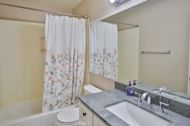 full bathroom featuring vanity, toilet, and shower / tub combo with curtain