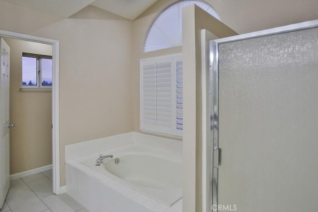 bathroom with tile patterned floors and independent shower and bath