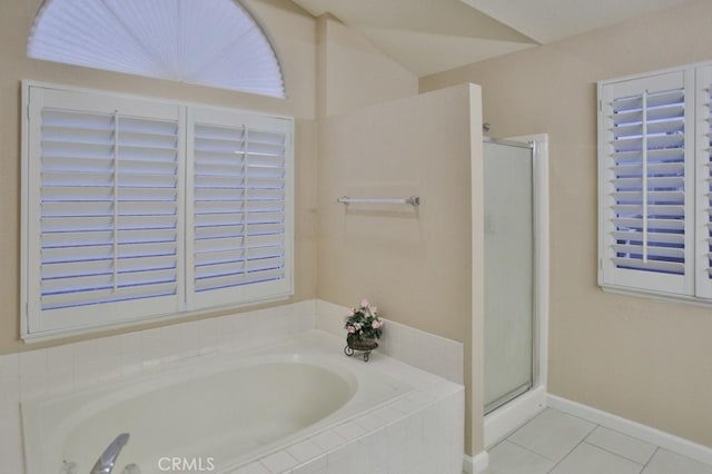 bathroom featuring tile patterned flooring and shower with separate bathtub