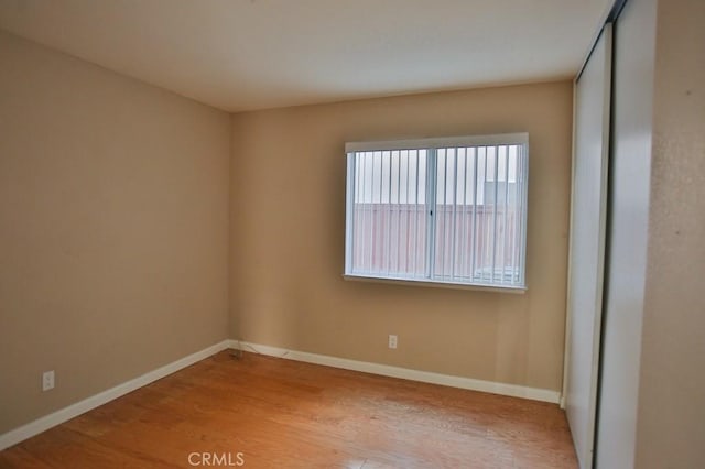 unfurnished room featuring light hardwood / wood-style floors