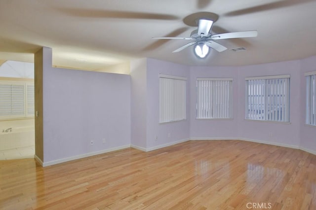 spare room featuring ceiling fan and light wood-type flooring