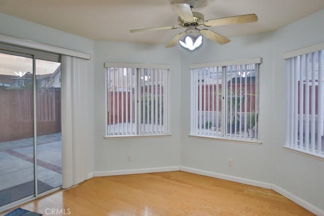 spare room featuring ceiling fan and light hardwood / wood-style flooring