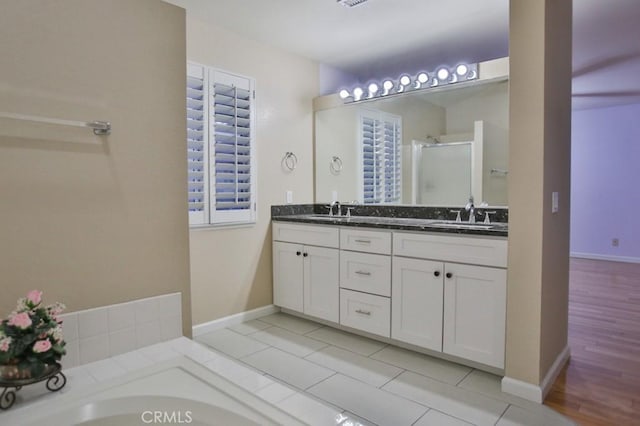 bathroom with vanity and plus walk in shower