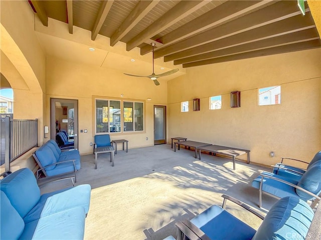 view of patio with an outdoor living space and ceiling fan