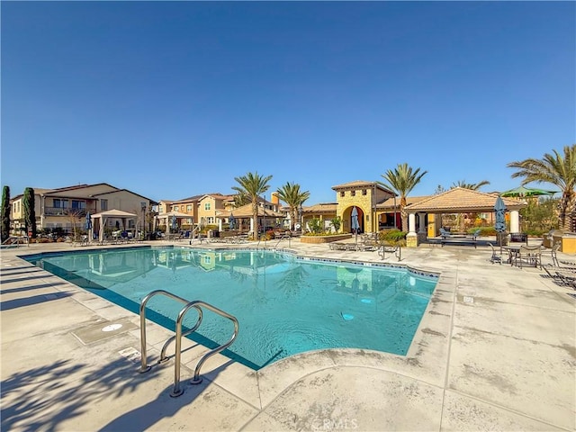 view of swimming pool featuring a gazebo and a patio area