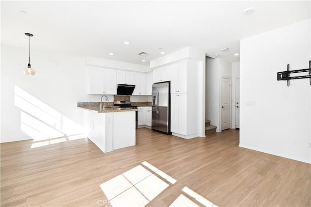 kitchen with white cabinetry, stone countertops, kitchen peninsula, stainless steel appliances, and exhaust hood