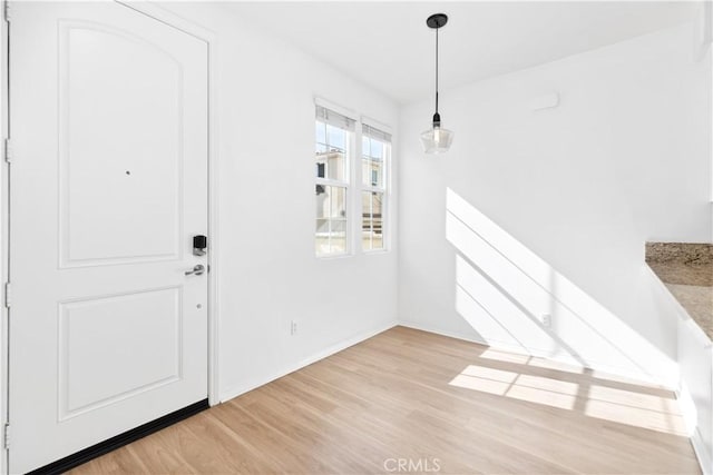 foyer with light wood-type flooring