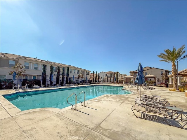 view of swimming pool featuring a patio area