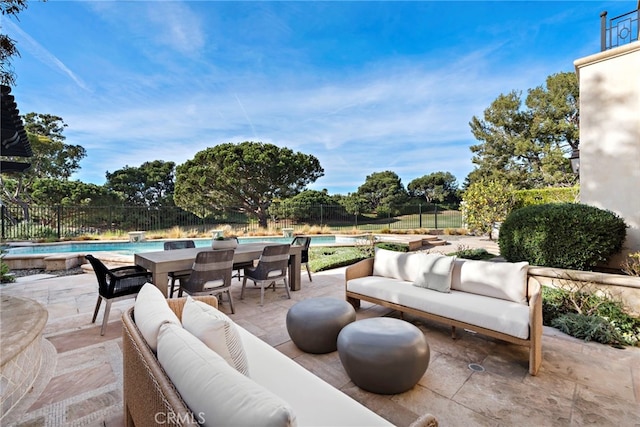 view of patio / terrace with outdoor lounge area and a fenced in pool