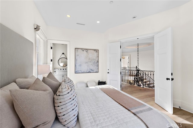 bedroom with light wood-type flooring