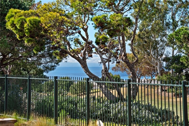 view of gate featuring a water view