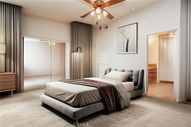 carpeted bedroom with a closet and ceiling fan