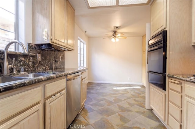 kitchen with black oven, light brown cabinetry, dishwasher, sink, and decorative backsplash