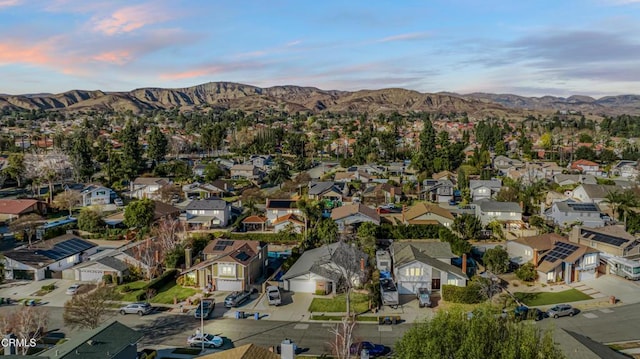 aerial view at dusk with a mountain view