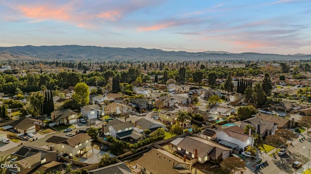 aerial view at dusk with a mountain view