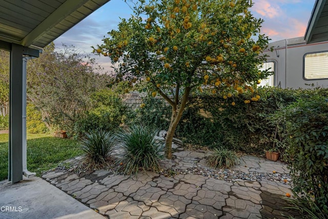 view of patio terrace at dusk