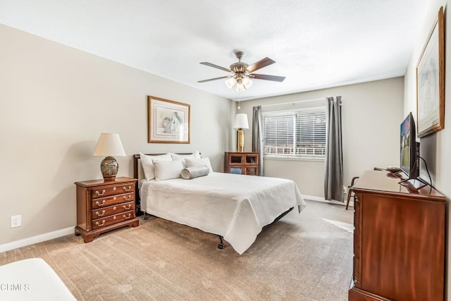 bedroom with ceiling fan and light colored carpet