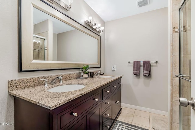 bathroom with vanity, tile patterned flooring, and a shower with shower door