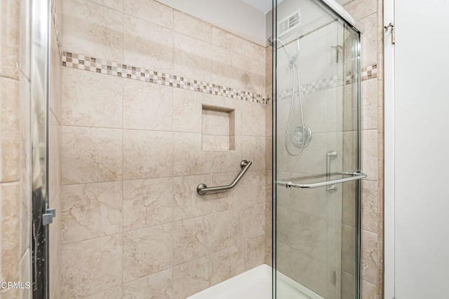 bathroom featuring an enclosed shower