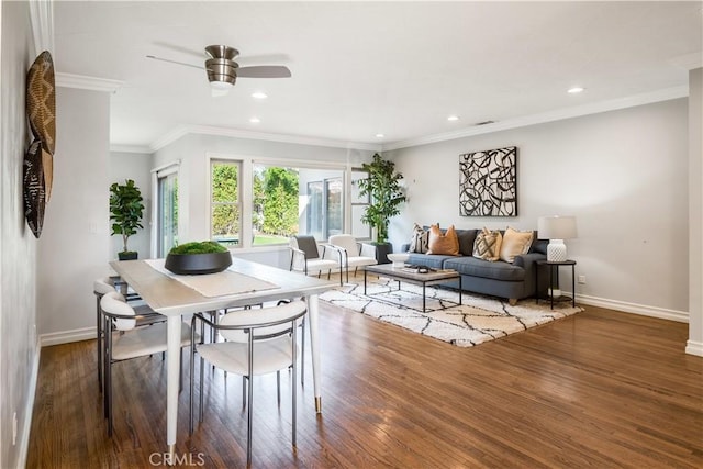 dining room with ceiling fan, ornamental molding, and dark hardwood / wood-style floors