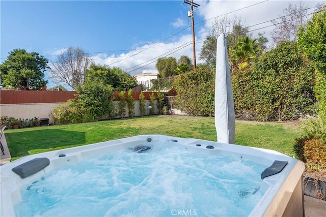 view of yard with a hot tub