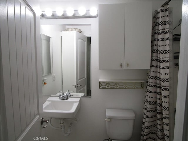 bathroom with sink and toilet