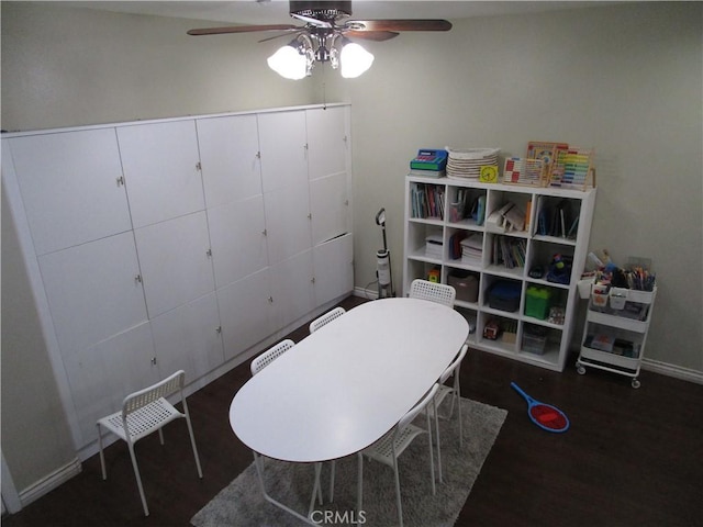 game room featuring dark hardwood / wood-style floors and ceiling fan